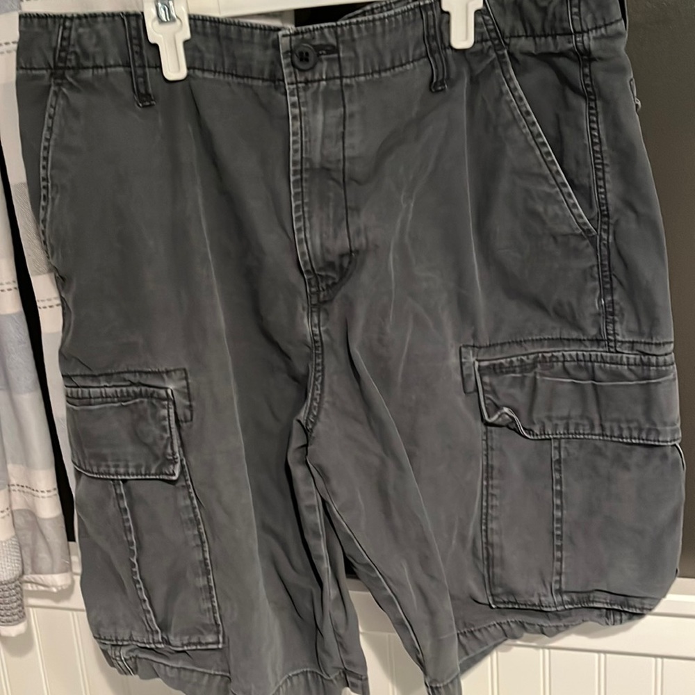 Old Navy- Men’s Dark grey, cargo pants with pockets and button. Size 38